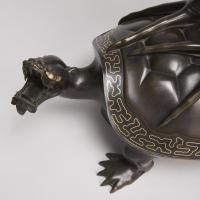An exceptional pair of multi metal Phoenixes mounted on turtles (Japanese, 1868 - 1912)
