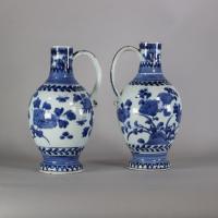 Sides of blue and white pair of Japanese jugs