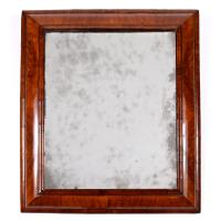 A William & Mary cushion-framed mirror