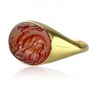 Agate scaraboid ring engraved with a lion seizing a deer. Greek, 5th century BC