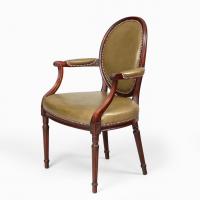 Four Edwardian mahogany chairs by Gill & Reigate