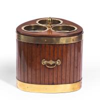 A George III mahogany and brass mounted wine cooler