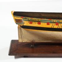 A carved and painted model of HMS Emerald, 1811 and ‘HMS Emerald and HMS Amethyst’ by Pocock