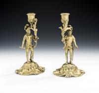 An important pair of Silver Gilt Figural cast candlesticks made in London in 1847 by Charles, Thomas & George Fox