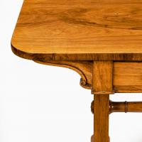 A late Regency rosewood end support table Gillows or Holland and Sons