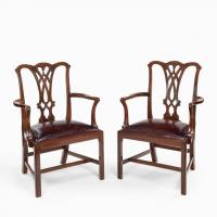 An extensive set of 34 mahogany chairs by Charles Baker, comprising four carvers and 30 side chairs