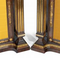 A pair of Regency brass-inlaid rosewood side cabinets