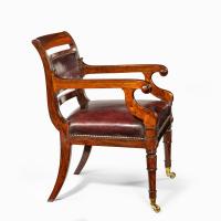 A rosewood library chair in the manner of Henry Holland made for the Senior Service Club