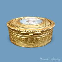 An Oval Gilt Metal Box With Painting of a Young Lady, circa 1900-1910