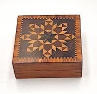 A Tunbridge Waresquare puzzle box with miniature parquetry decoration.