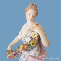 A Beautiful Meissen Porcelain Figure Of A Young Woman Representing The Season Of Spring, circa 1880