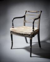 George III Armchair in ebonised beech with a caned seat and gilt decoration
