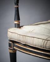 George III Armchair in ebonised beech with a caned seat and gilt decoration