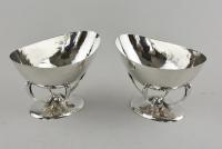 A pair of Arts and Crafts hammered silver dishes