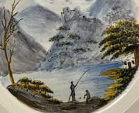 A Swansea Pottery pearlware charger decorated Pratt colours with view of Dolbadarn Castle circa 1800