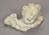 A pair of carved white marble reliefs of cherubs, c.1700