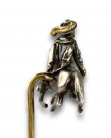 Silver & gold stick pin of a 17th century man on a horse. French, 19th century