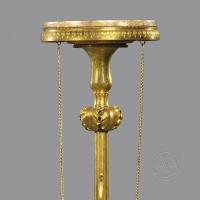 A Detail of a Pair of Rare 'Neo-Grec' Gilt and Patinated Bronze Torchère Stands