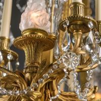 A Detail of A Louis XVI Style Cut-Crystal Eighteen-Light Oval Figural Chandelier