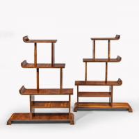 A pair of asymmetrical Art Deco walnut shelves