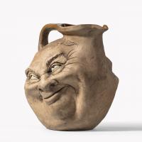 A Martinware double-sided stoneware pottery ‘face’ jug, dated 1896