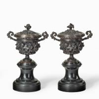 A pair of bronze vases and covers in the classical style