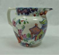 A small hand coloured Semi China jug, English c.1820