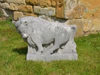 A Portland stone sculpture of a bull (Taurus) by Roy Smith RWA
