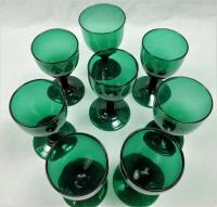 A set of eight tulip shaped 'Bristol' green wine glasses, English circa 1800.