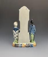Yorkshire prattware pottery clock money box with soldier and maiden circa 1810
