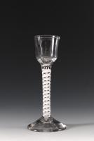 A tall wineglass, ogee bowl