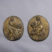 A Pair of Oval Bronze Reliefs After Clodion