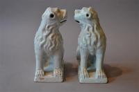 A pair of 18th century white tin glazed lions
