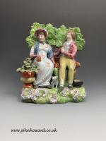 Antique Staffordshire pottery bocage figure group of Persuasion early 19th century