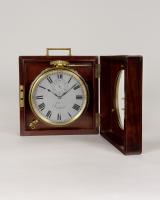 A good Victorian period English table timepiece in its original finely fitted mahogany travelling case