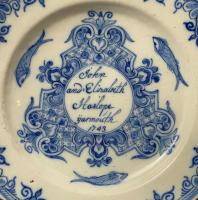 Delft pottery plate named and dated John and Elizabeth Haslope Yarmouth 1743