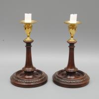 A Pair of Late 18th Century Mahogany and Brass Candlesticks