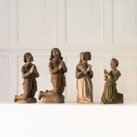 A rare family group of four polychromed limewood kneeling figures, English, circa 1610-1630