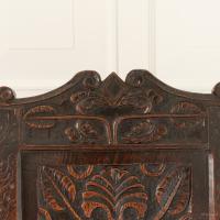 A documented Charles I oak panel-back open armchair, West Country, circa 1630