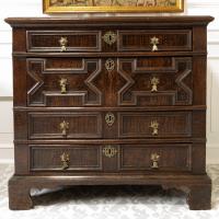 A rare Charles II joined oak and elm chest of drawers, with simulated oyster veneer decoration, circa 1680