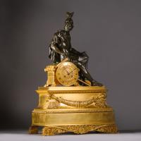 A Charles X Gilt and Patinated Bronze Figural Mantel Clock 