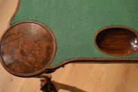 A George II walnut concertina card table