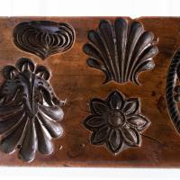 An 18th century carved fruitwood culinary mould in the form of a lidded box