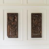 Two early 16th century carved panels of Saints Peter and Paul