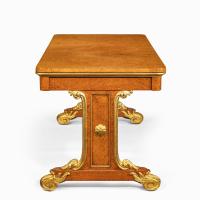 Regency amboyna and gilt library table