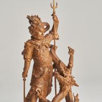 A dramatic and intricately carved wood Okimono of Ryujin, the Dragon God of the Sea (1880)