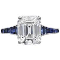 3.20ct emerald-cut diamond ring with calibre-cut sapphire band