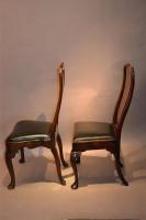 A matched pair of early 18th century walnut chairs