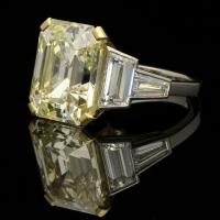 Hancocks 8.73ct Vintage Emerald-Cut Pale Yellow Diamond Ring With Diamond Shoulders