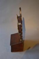 A Regency oak spoon rack